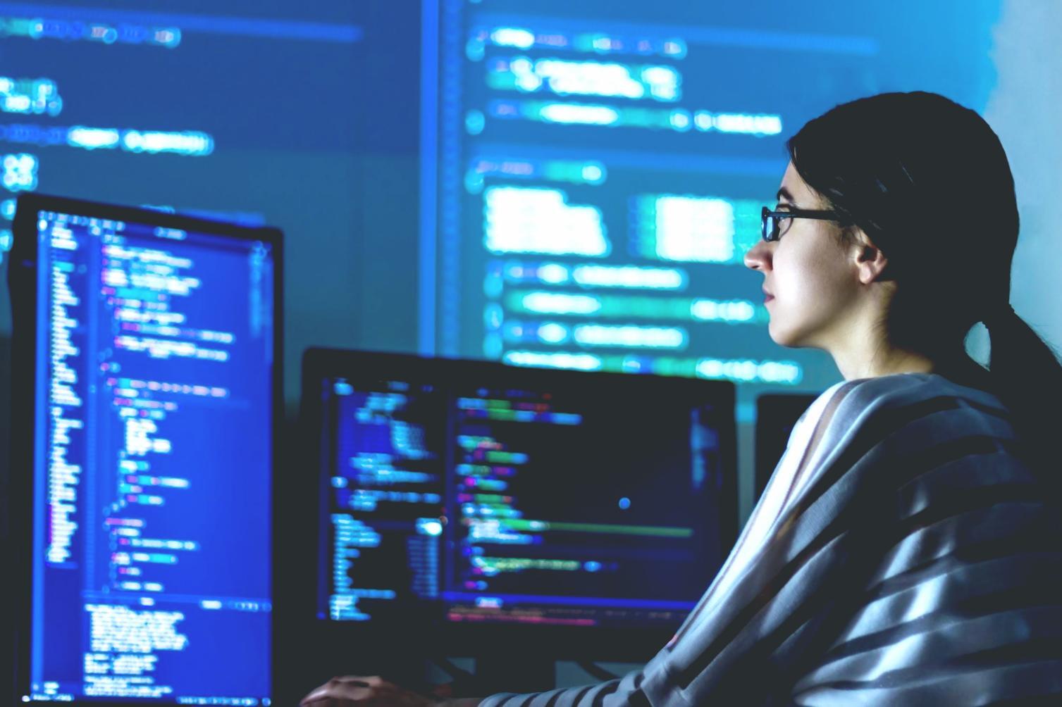 Students working on AI visualization projects in modern computer lab